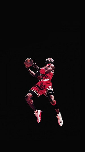 Michael Jordan in mid-air dunk wearing Chicago Bulls red jersey against a black background HD phone wallpaper