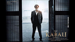 Rajinikanth in a dark suit standing in a doorway from the movie Kabali HD wallpaper