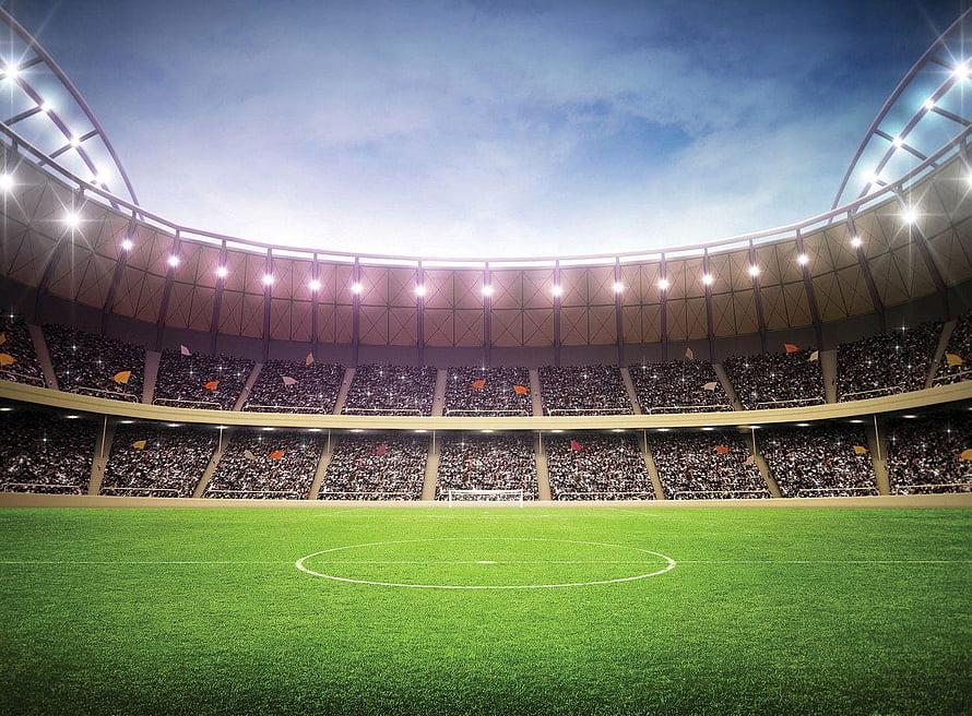 Vast Football Stadium Interior With Packed Stands And Floodlit Pitch HD wallpaper