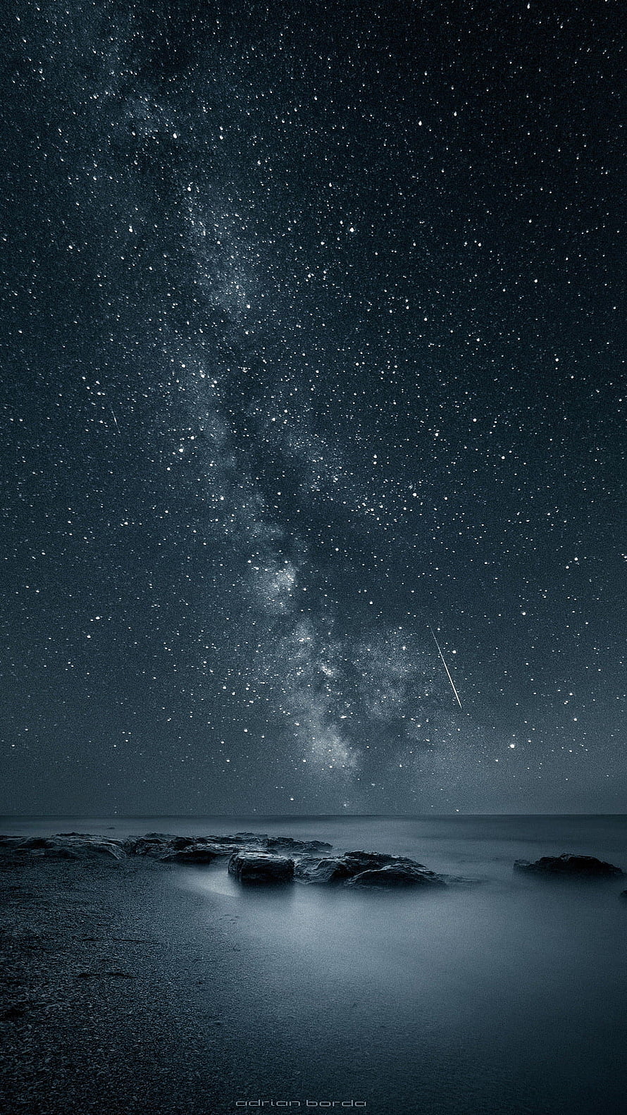 Milky Way Galaxy Over a Dark Ocean Beach at Night with a Shooting Star HD phone wallpaper