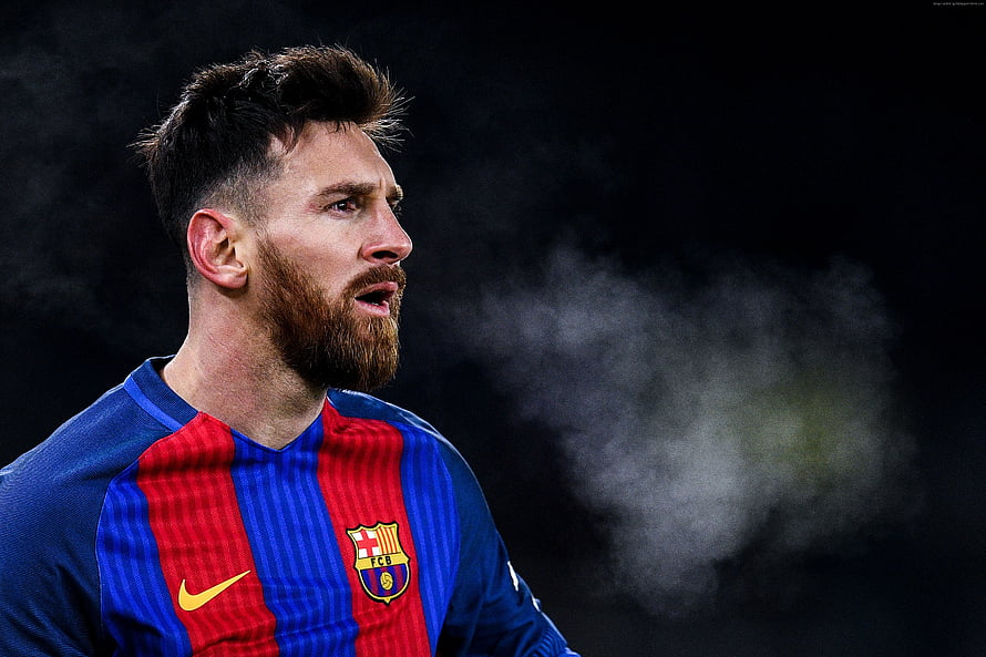 Lionel Messi in FC Barcelona Home Kit with Dramatic Dark Background and Smoke HD wallpaper