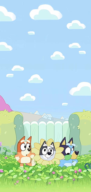 Bluey and Bingo Cartoon Characters in a Sunny Garden with Flowers and Clouds HD phone wallpaper