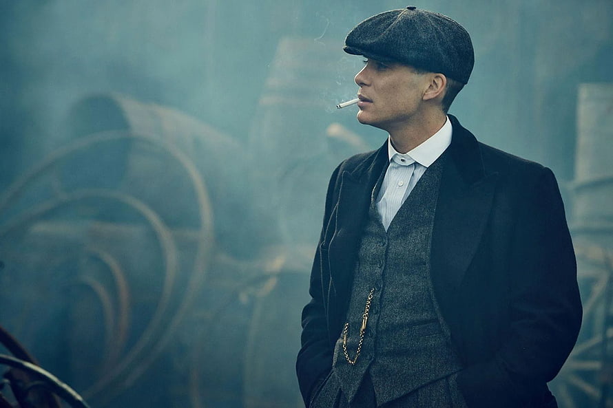 Peaky Blinders Tommy Shelby in Flat Cap and Three-Piece Suit Smoking in Industrial Fog HD wallpaper