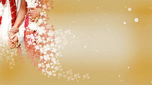 Indian Wedding Couple Holding Hands with Floral Overlay on Golden Background HD wallpaper