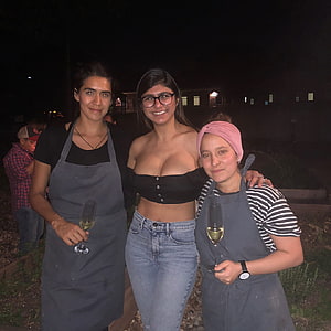 Three Women Holding Champagne Glasses at a Nighttime Outdoor Gathering HD phone wallpaper