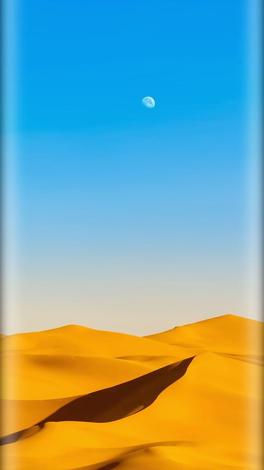 Golden Desert Dunes Under a Clear Blue Sky with a Visible Moon HD phone wallpaper
