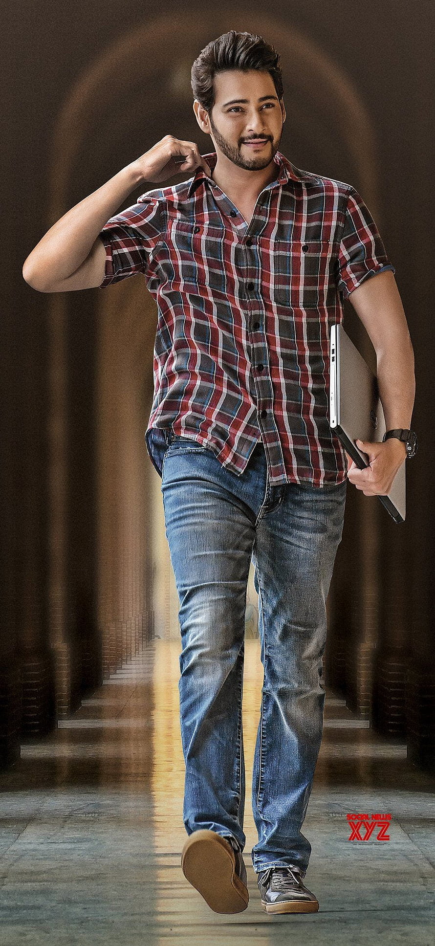 Mahesh Babu in Casual Plaid Shirt and Jeans Walking Through Arched Corridor HD phone wallpaper