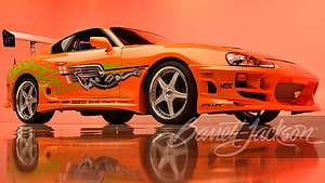 Paul Walker's Orange Toyota Supra from Fast and the Furious with Custom Graphics HD wallpaper