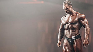 Chris Bumstead Classic Physique Olympia Stage Pose HD wallpaper