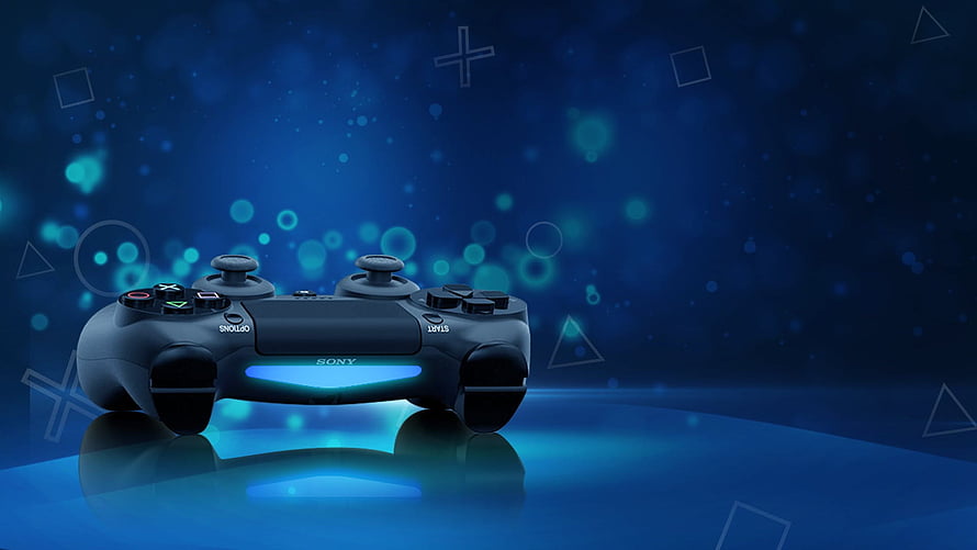 Sony PlayStation 3 DualShock Controller on Glowing Blue Surface with Bokeh Background HD wallpaper