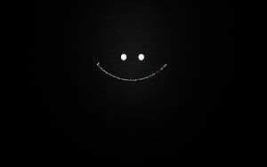 Minimalist Smiley Face with Curved Text on Black Background HD wallpaper