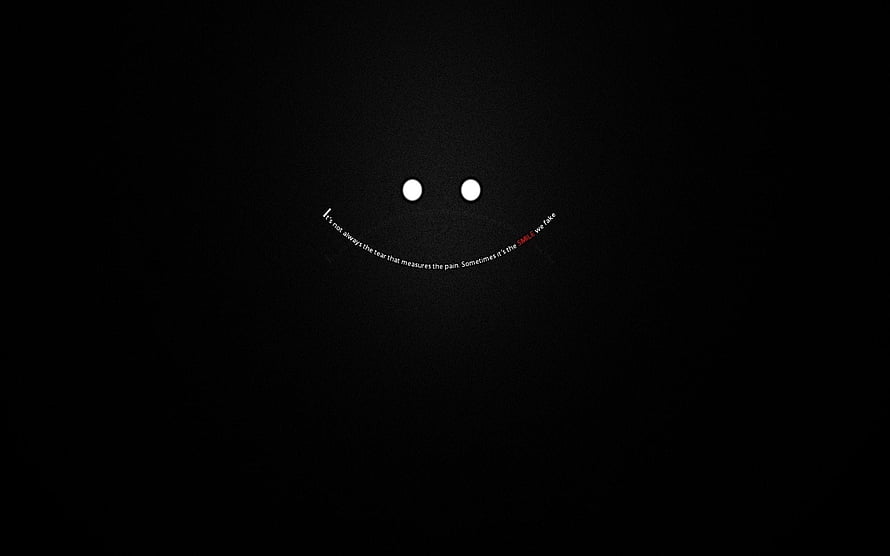 Minimalist Smiley Face with Curved Text on Black Background HD wallpaper