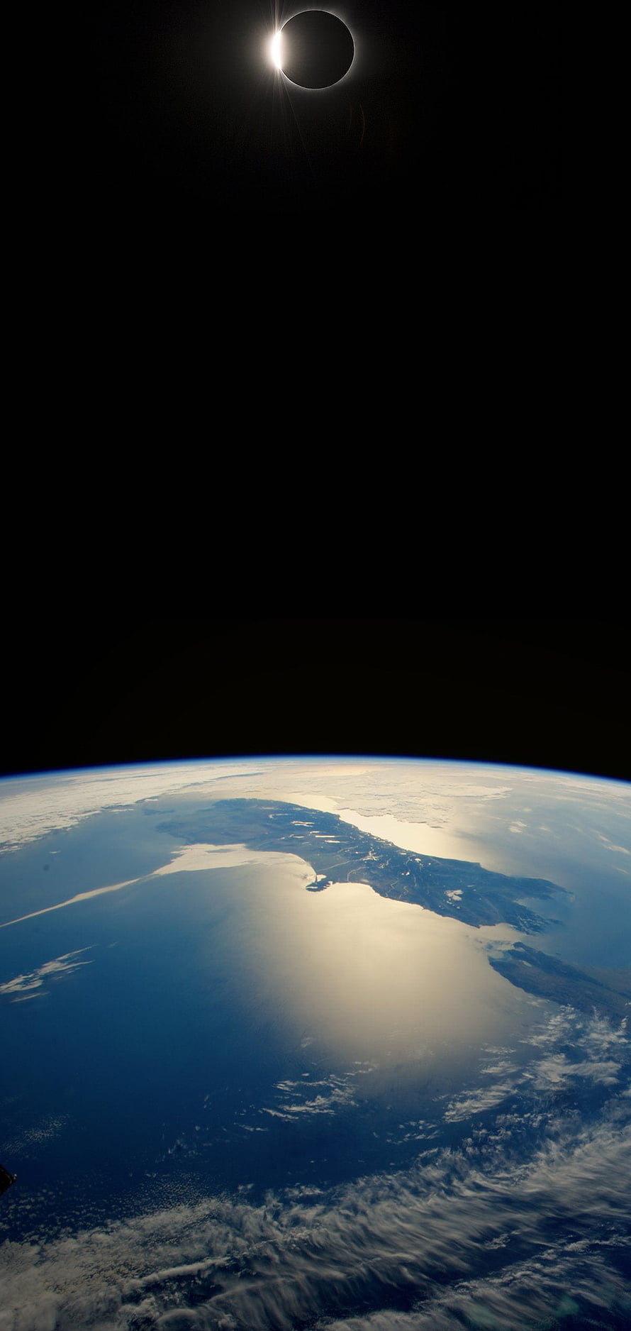 Total Solar Eclipse Over Earth's Curved Horizon From Space HD phone wallpaper