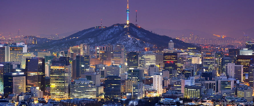 Seoul Cityscape at Dusk with Namsan Tower and Snow-Capped Hill HD wallpaper