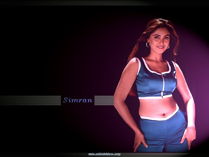 Simran in a Blue Two-Piece Outfit with White Trim Against a Dark Background HD wallpaper