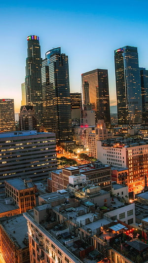 Los Angeles Downtown Skyline at Dusk with Glowing Skyscrapers and Rooftop Views HD phone wallpaper