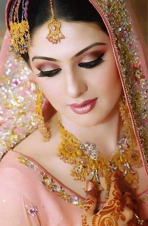 Elegant Indian Bride in Pink Lehenga with Gold Jewelry and Henna HD phone wallpaper