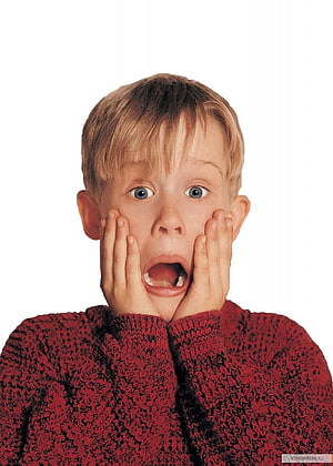 Kevin McCallister from Home Alone in a red sweater with a shocked expression HD phone wallpaper