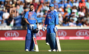Virat Kohli and MS Dhoni in India Cricket Team Blue ODI Uniforms on the Field HD wallpaper