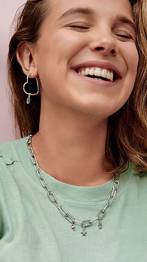 Millie Bobby Brown Wearing Heart Earrings And Chain Necklace In Mint Green Top HD phone wallpaper