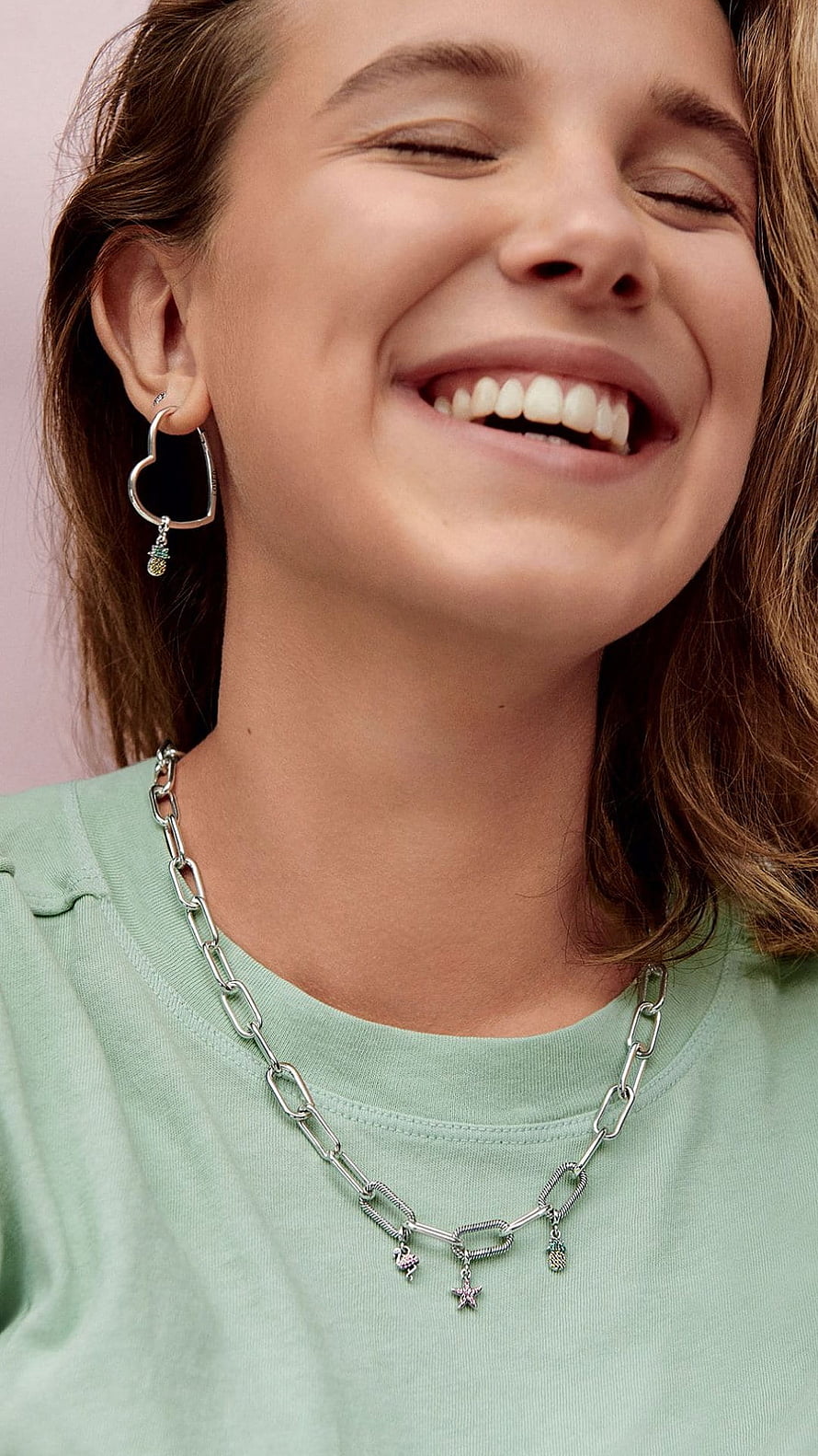 Millie Bobby Brown Wearing Heart Earrings And Chain Necklace In Mint Green Top HD phone wallpaper