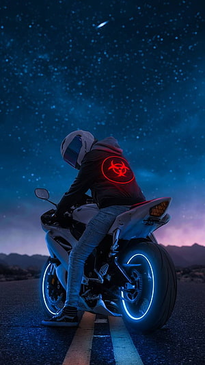 Biker on a Neon-Lit Sport Motorcycle Under a Starry Night Sky HD phone wallpaper