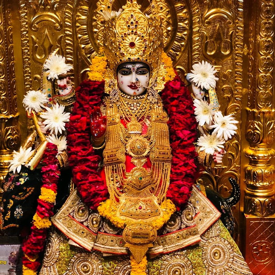 Meldi Maa Malataj Temple Deity Adorned in Gold Jewelry and Red Marigold Garlands HD phone wallpaper