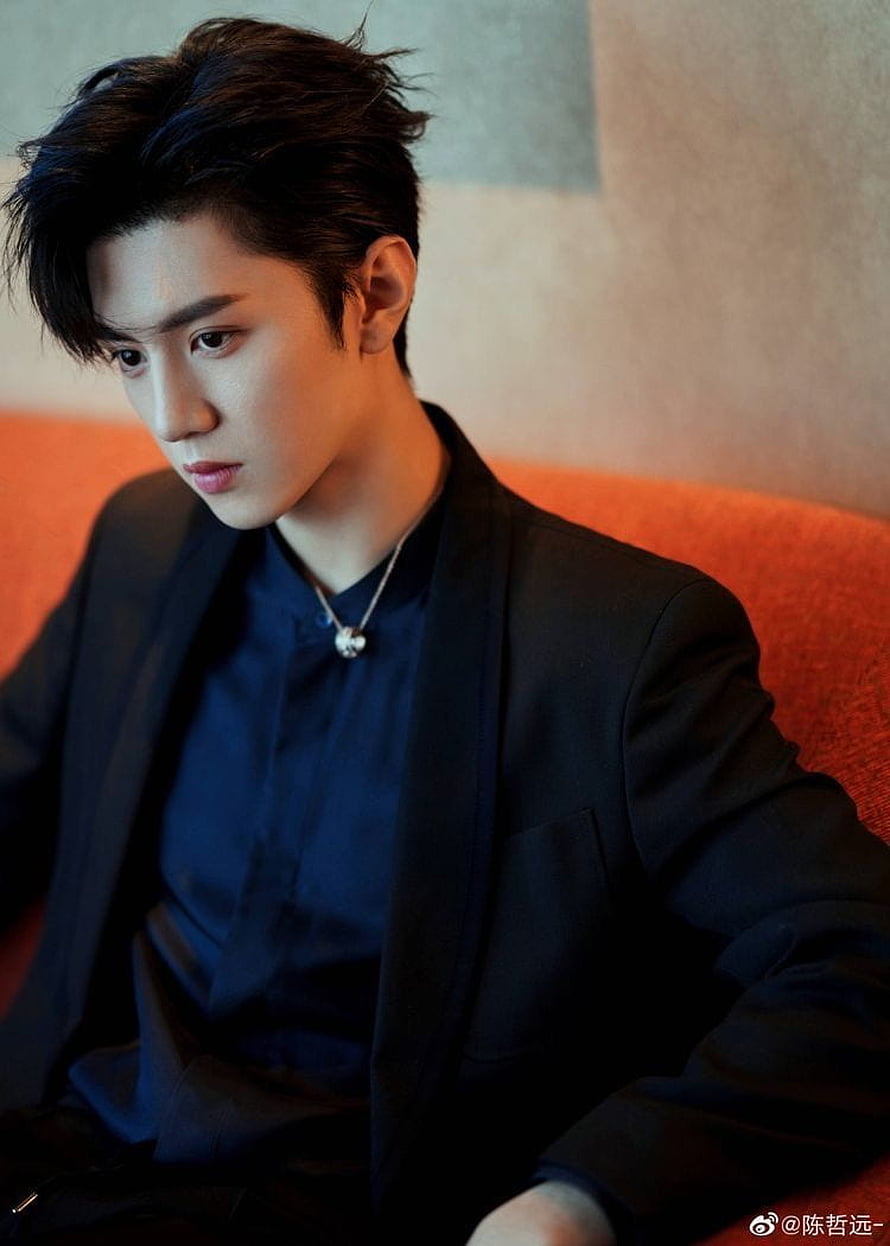 Chen Zhe Yuan in a black suit and navy shirt with a pendant necklace HD phone wallpaper