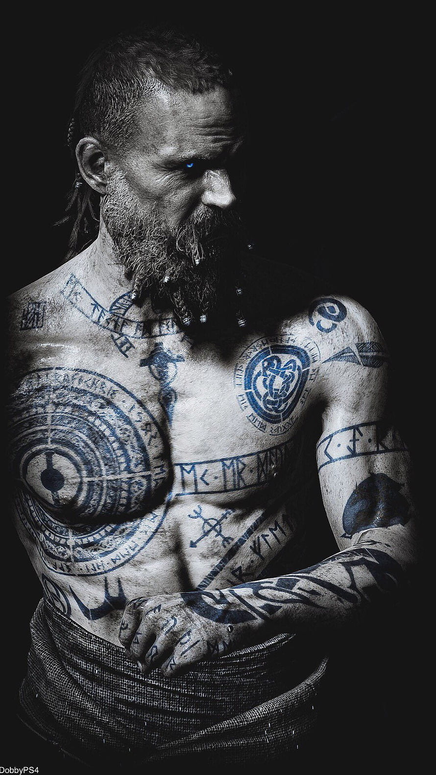 Baldur from God of War with intricate blue tattoos and glowing blue eyes in a dark portrait HD phone wallpaper