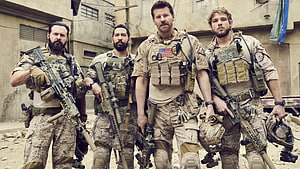 Navy SEALs Team in Desert Combat Gear Standing in Middle Eastern Urban Setting HD wallpaper