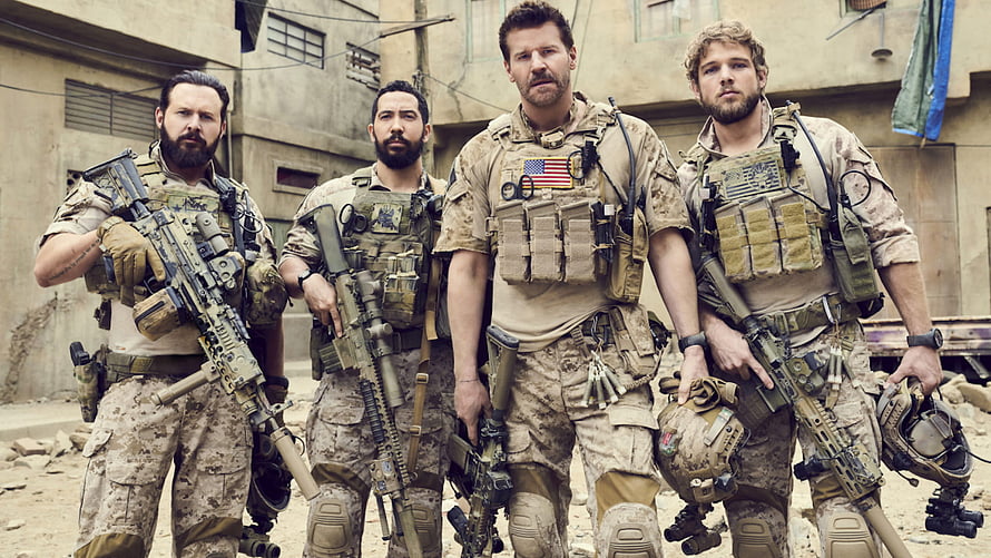 Navy SEALs Team in Desert Combat Gear Standing in Middle Eastern Urban Setting HD wallpaper