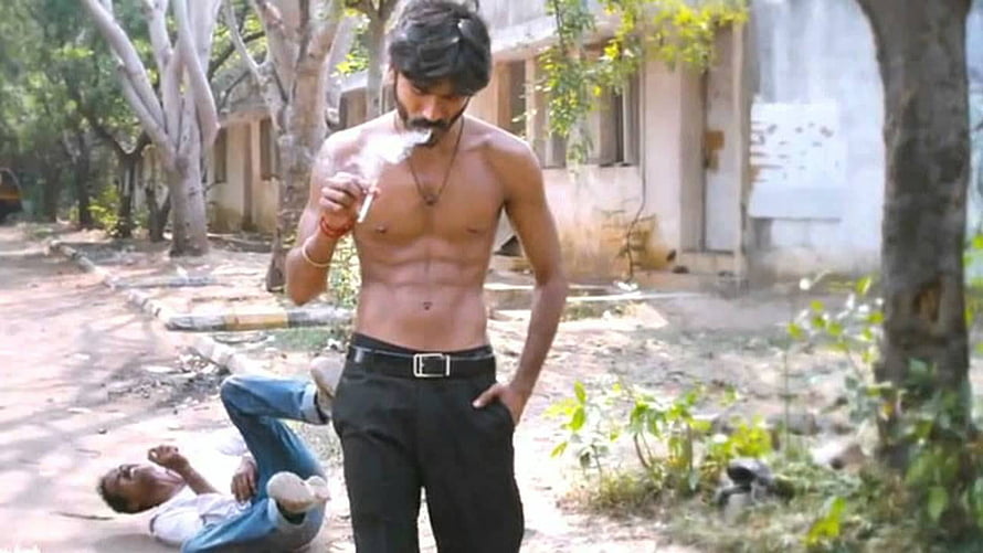 Dhanush shirtless with six pack abs smoking cigarette in outdoor scene HD wallpaper