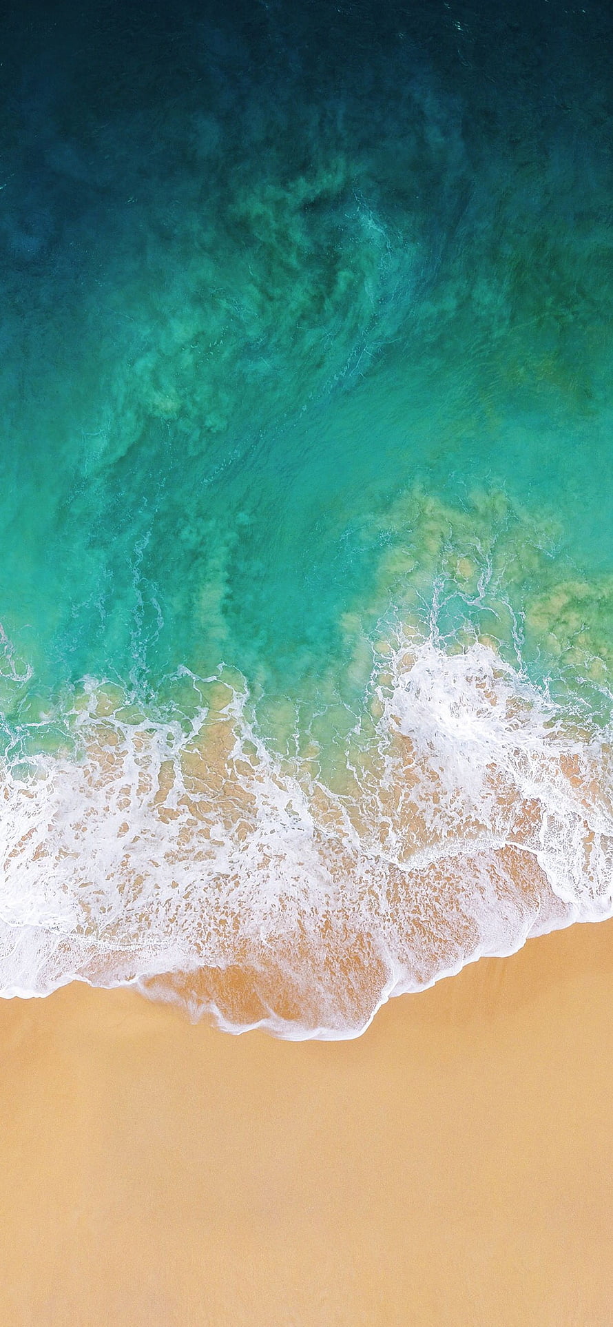 Aerial View of Turquoise Ocean Waves Rolling onto Golden Sandy Beach HD phone wallpaper