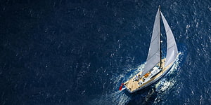 Aerial View of Oyster Luxury Sailing Yacht Gliding Across Deep Blue Ocean Waters HD wallpaper