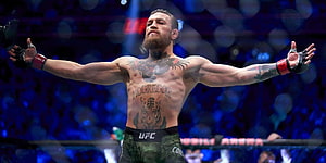 Conor McGregor Celebrates Victory in UFC Octagon with Arms Wide Open HD wallpaper