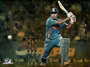 MS Dhoni in Action: Indian Cricket Captain Playing a Powerful Shot HD wallpaper
