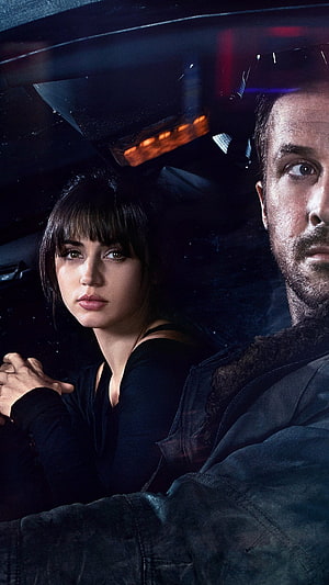 Blade Runner 2049 cinematic still featuring Ryan Gosling and Ana de Armas in a dark vehicle interior HD phone wallpaper