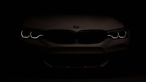 BMW M5 F90 Front Fascade with Illuminated Headlights in Dark Setting HD wallpaper