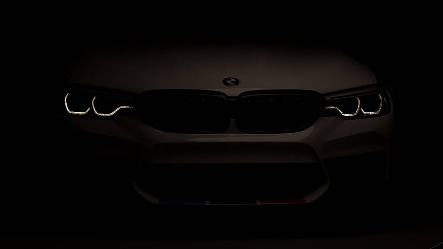 BMW M5 F90 Front Fascade with Illuminated Headlights in Dark Setting HD wallpaper