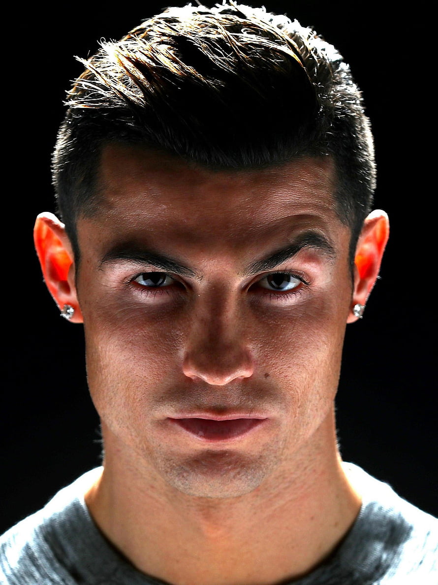Cristiano Ronaldo Intense Close-Up Portrait With Diamond Earrings Against Black Background HD phone wallpaper