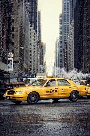 Classic Yellow NYC Taxi Cab Driving Through Manhattan City Streets HD phone wallpaper