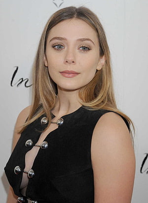 Elizabeth Olsen in a Black Sleeveless Dress with Silver Button Details at a Red Carpet Event HD phone wallpaper