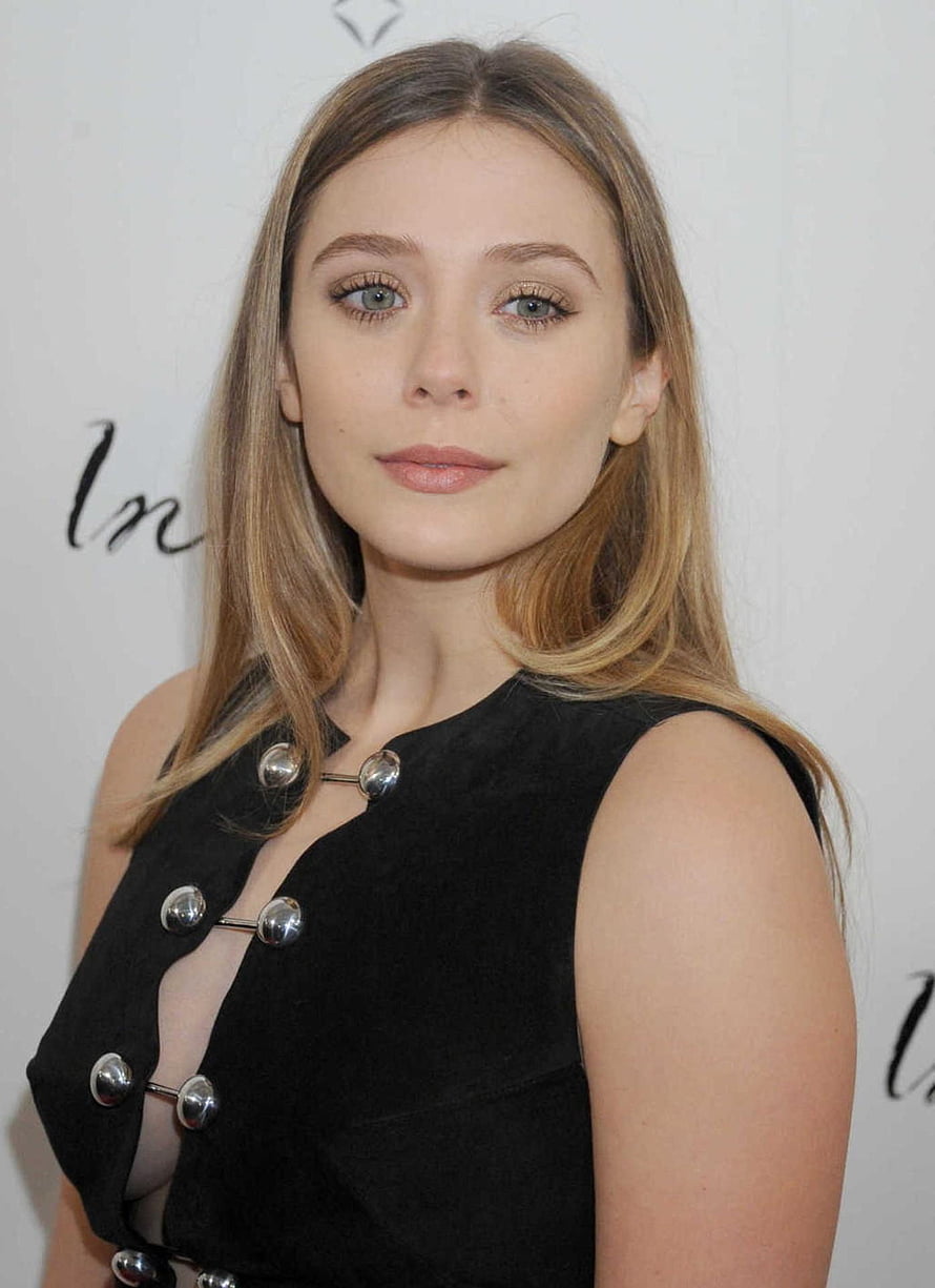 Elizabeth Olsen in a Black Sleeveless Dress with Silver Button Details at a Red Carpet Event HD phone wallpaper