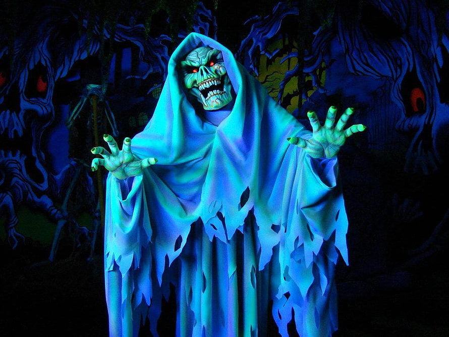 Eerie Ghostly Figure in Tattered Blue Robe with Glowing Red Eyes in Dark Forest HD wallpaper