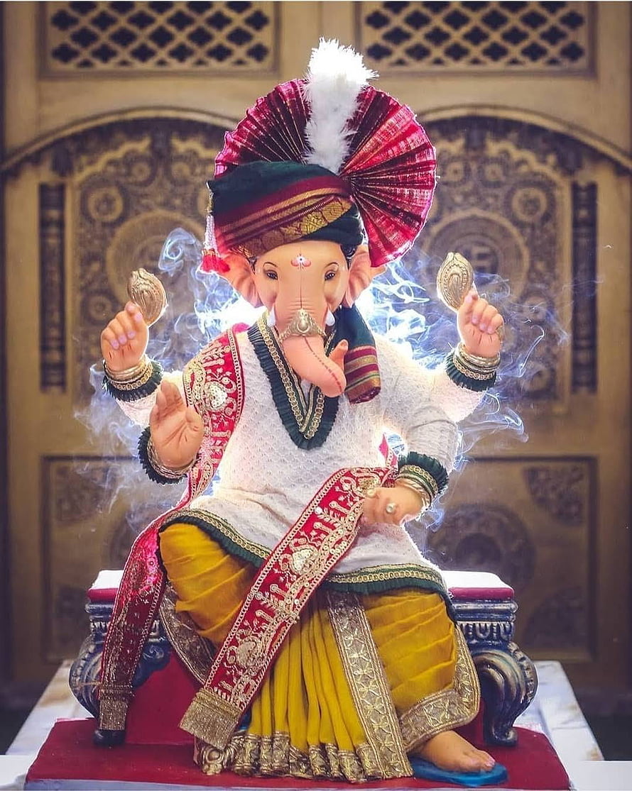 Ornate Ganesha Murti in Traditional Attire with Incense Smoke and Decorative Turban HD phone wallpaper
