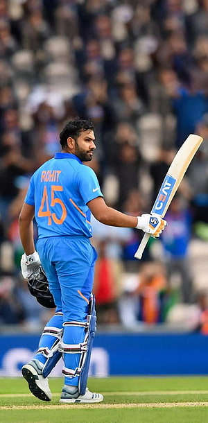 Rohit Sharma in Indian Cricket Team Blue Jersey Walking on the Field HD phone wallpaper