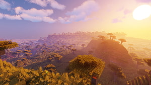 Minecraft Shaders Landscape at Golden Hour with Vast Blocky Terrain and Warm Sunset Sky HD wallpaper