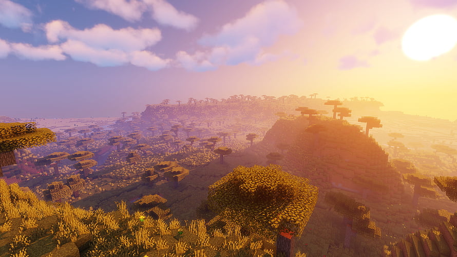 Minecraft Shaders Landscape at Golden Hour with Vast Blocky Terrain and Warm Sunset Sky HD wallpaper