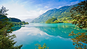 Serene Alpine Lake with Turquoise Water and Mountain Reflections HD wallpaper