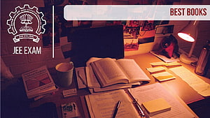 IIT JEE Exam Study Desk with Open Books, Notebooks, and Warm Lamp Light HD wallpaper